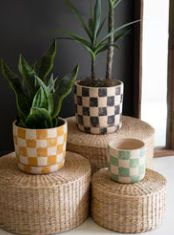 SET OF THREE CHECKERED CLAY PLANTERS WITH TRAYS