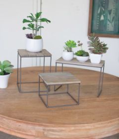 SET OF THREE WOOD AND METAL RISERS