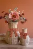 SET OF TWO TWISTED PAPER VASES WITH BOWS