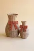SET OF TWO TWISTED PAPER VASES WITH BOWS