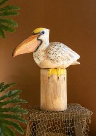 CARVED WOODEN PELICAN ON A PILING