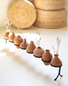 EIGHT CLAY VESSELS ON AN IRON BASE (MIN 2)