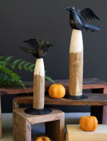 SET OF TWO BLACK IRON CROWS ON WOODEN BASES