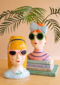 SET OF TWO CERAMIC GIRLS WITH SUNGLASSES VASES