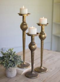 SET OF THREE ANTIQUE BRASS FINISH CANDLE STANDS