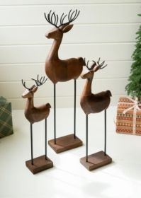 SET OF THREE CARVED WOOD AND IRON REINDEER ON BASES