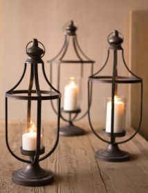 SET OF THREE METAL LANTERNS WITH GLASS INSERT