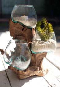 THREE BLOWN GLASS BOWLS ON A DRIFTWOOD BASE